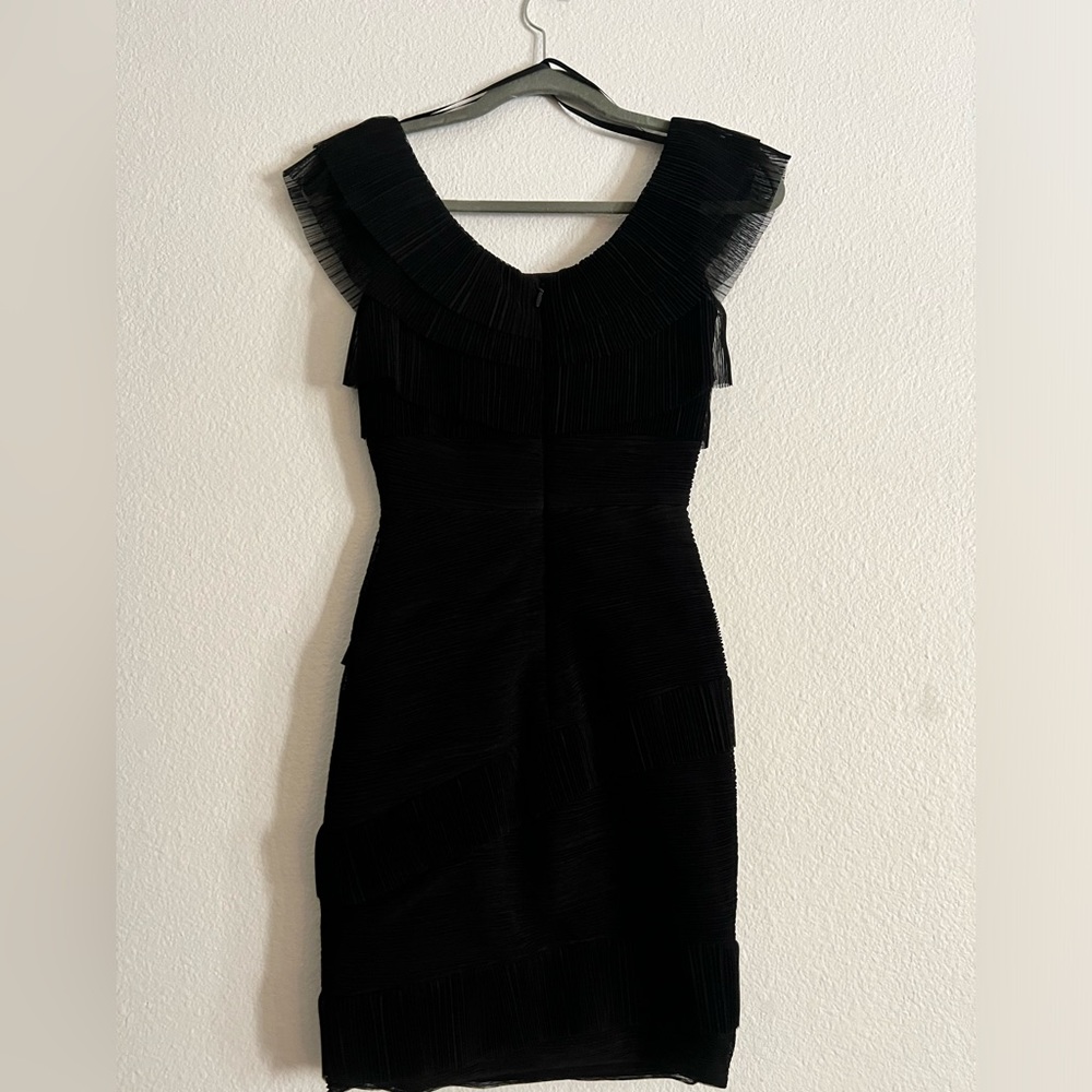 Only worn once, stretch, slim fit with ruffles, very elegant, over the knee.